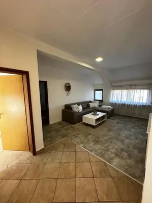 a living room with a couch and a table at Milincic‘s 2 Zimmerwohnung in Banja Luka