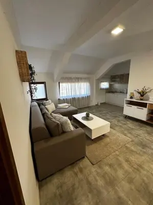 a living room with a couch and a coffee table at Milincic‘s 2 Zimmerwohnung in Banja Luka
