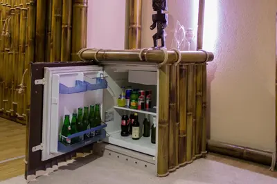 a small refrigerator filled with lots of beer bottles at Motel Dani in Nova Bila