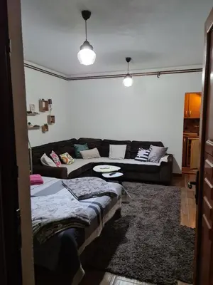 a living room with two beds and a couch at Studio Apartman Ana Doboj in Doboj