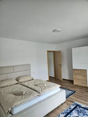 a bedroom with a large bed in a room at Villa Pliva Lake 2 in Jajce