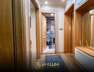 a hallway with a door to a room with a bathroom at Stan na dan Apollon Doboj in Doboj
