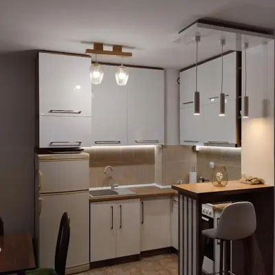 a kitchen with white cabinets and a sink at Ananbi in Banja Luka