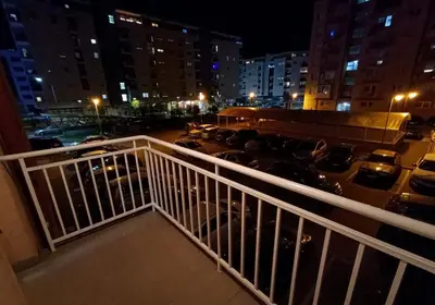 a view of a parking lot at night at Ananbi in Banja Luka