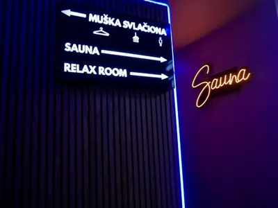 a sign that says santa cruz and arak room at Wellness Spa Hotel Jola in Banja Luka