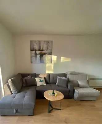 a living room with a couch and a table at Apartment Znaor in Kupres