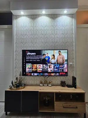 a large flat screen tv on a wall at Apartman Ema Tuzla in Tuzla