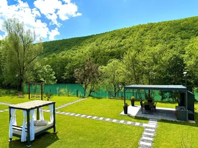 a garden with a gazebo and a playground at Aqua Vita Concept in Bihać