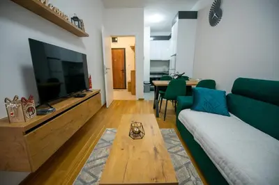 a living room with a couch and a coffee table at Apartman Mihalena in Banja Luka