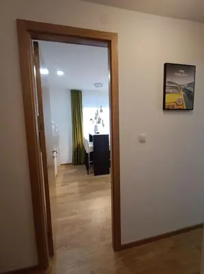 a door leading into a room with a dining room at Apartment Allora ,with garage in Banja Luka