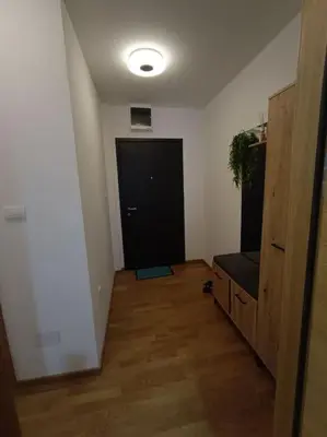 a room with a hallway with a black door at Apartment Allora ,with garage in Banja Luka