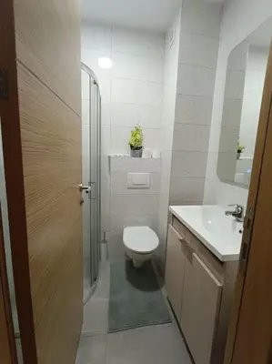 a bathroom with a toilet and a sink at Apartment Allora ,with garage in Banja Luka