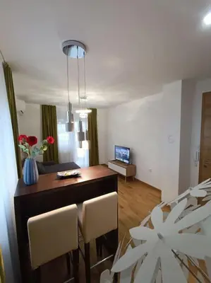 a kitchen and dining room with a table and chairs at Apartment Allora ,with garage in Banja Luka