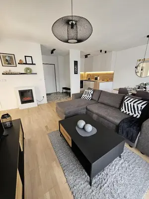 a living room with a couch and a table at Apartman 33 in Kiseljak