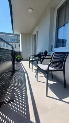 a group of benches sitting on a balcony at Apartman 33 in Kiseljak