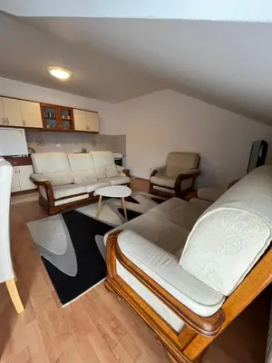 a living room with two beds and a couch at Apartman Oskar 1 in Kupres