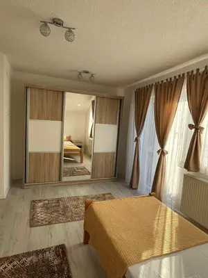 a bedroom with a large mirror and a bed at BORIĆI in Bihać