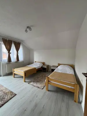 a bedroom with two beds in a room at BORIĆI in Bihać
