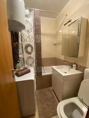 a bathroom with a sink and a toilet and a shower at Apartman A&A in Banja Luka
