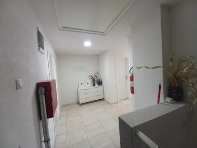 a white room with a kitchen with a refrigerator at SOBE CICKO in Bosansko Petrovo Selo
