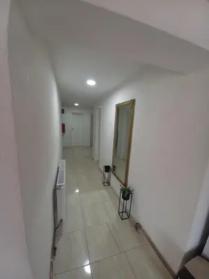 a hallway with a mirror on the wall and a mirror at SOBE CICKO in Bosansko Petrovo Selo
