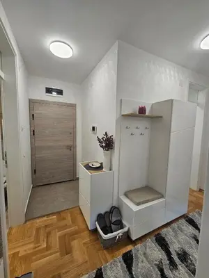 a room with a white cabinet and a door at Apartment Zidart Banja Luka free garage in Banja Luka