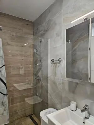 a bathroom with a shower and a sink at Apartment Zidart Banja Luka free garage in Banja Luka