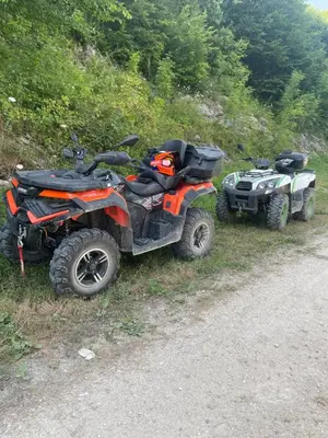 two atvs parked on the side of a road at Vikendica u prirodi na ranču in Zolaći