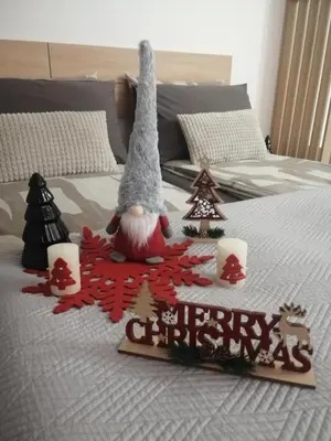a bed with a christmas decorations on it at Apartman 33 in Banja Luka