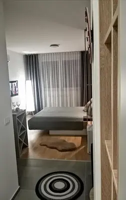 a bedroom with a bed in a room at Apartman 33 in Banja Luka