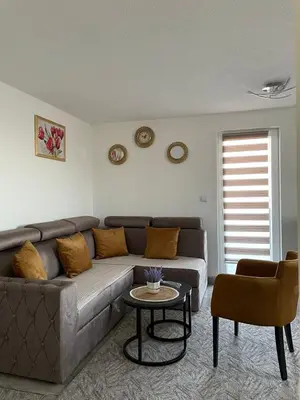 a living room with a couch and a table at Villa SHAMS in Travnik