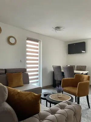 a living room with a couch and chairs and a table at Villa SHAMS in Travnik