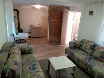 a living room with a couch and a table at Apartman Babli in Banja Luka