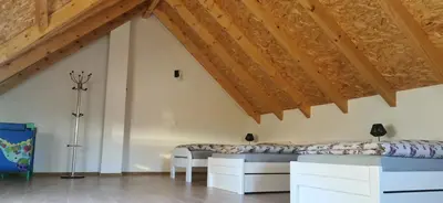 a bedroom with two beds in a attic at Fortuna in Livno