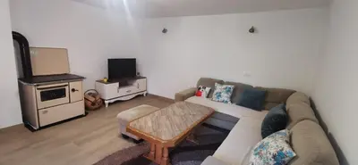 a living room with a couch and a tv at Fortuna in Livno