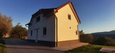 a small white building on the side of a road at Fortuna in Livno