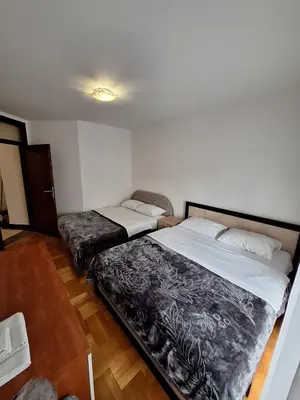a bedroom with two beds in a room at Luks 3 apartment in Banja Luka