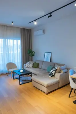 a living room with a couch and a table at Apartment ALPHA in Banja Luka