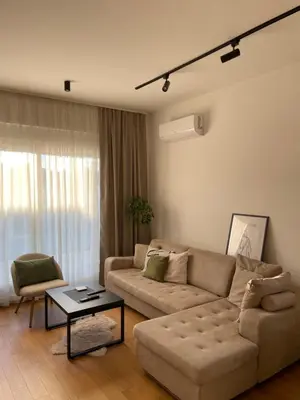 a living room with a couch and a table at Apartment ALPHA in Banja Luka