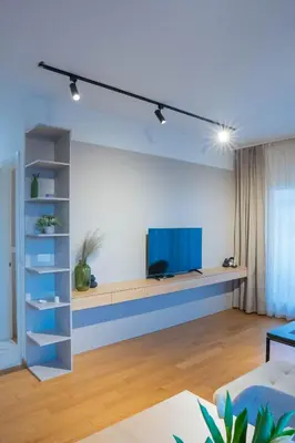 a living room with a tv on a wall at Apartment ALPHA in Banja Luka