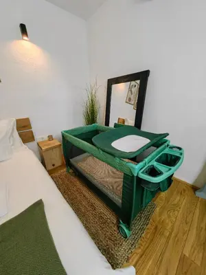 a bathroom with a green sink in a room at Garden Relax Bungalow 