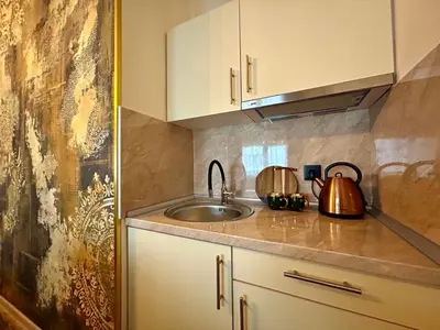 a kitchen with a sink and a counter top at AD BASANTE in Bosanski Šamac