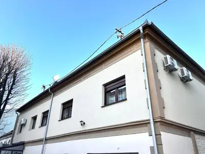 a white building with windows on top of it at AD BASANTE in Bosanski Šamac