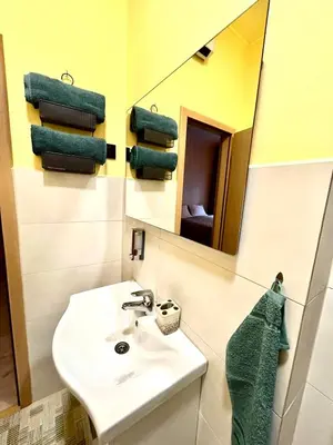 a bathroom with a sink and a mirror at AD BASANTE in Bosanski Šamac
