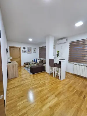 a living room with a couch and a table at Apartman 36 Banja Luka in Banja Luka