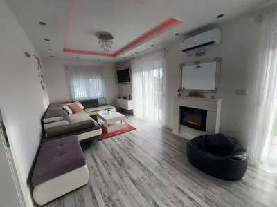 a living room with a couch and a tv at Apartman TT Stan na dan Trn Laktaši in Laktaši