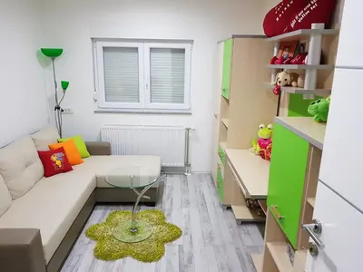 a living room with a couch and a glass table at Apartman TT Stan na dan Trn Laktaši in Laktaši