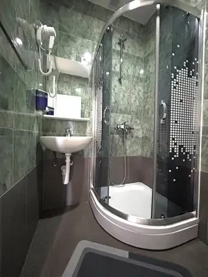 a bathroom with a shower and a sink at Rooms ALEA in Sanski most
