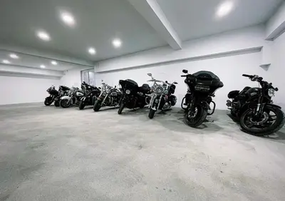 a row of motorcycles parked in a garage at Apartmani Villa Grande in Bugojno