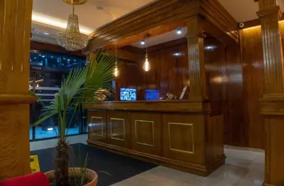 a bar in a restaurant with wooden walls at Apartmani Villa Grande in Bugojno